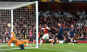 Alexandre Lacazette scores his and Arsenal’s second with a bit of help from Neto and goal-line technology.