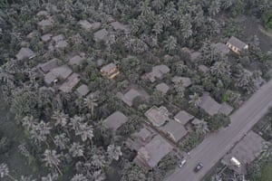 Ash-covered houses and vegetation in Juban