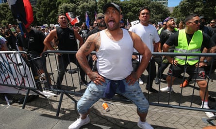 Anti-vaccine mandate protesters perform a haka outside parliament in Wellington.
