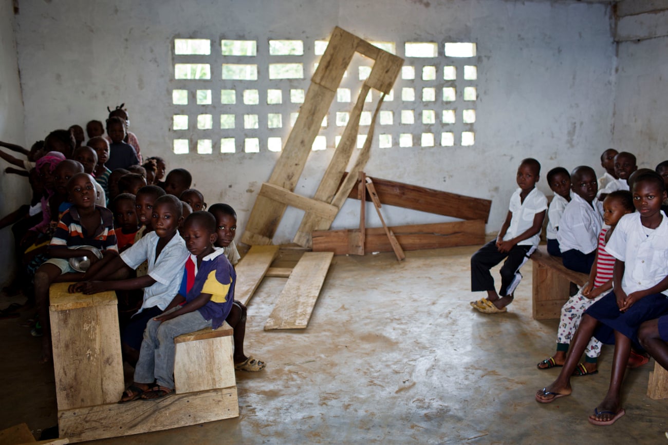 Liberia hopes that by bringing private companies into its education system it can end scenes like this at a Montserrado primary school where children are crammed on to classroom furniture.