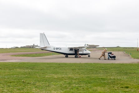 Muir greets the plane from Kirkwall on the Orkney mainland