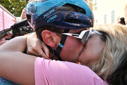 Alberto Bettiol and his girlfriend, Lisa Finetti, embrace after the stage