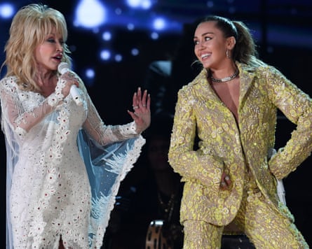 Dolly Parton and, right, Miley Cyrus performing at the Grammy awards in 2019.