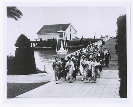 people walking on a waterfront