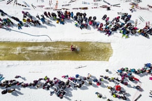 A skier participates in a waterslide contest in Nendaz