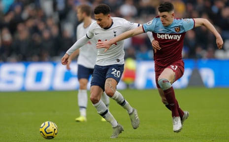 Dele Alli tussles for the ball with Declan Rice.