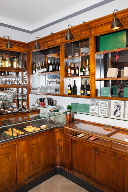 A wooden counter in a shop selling wine