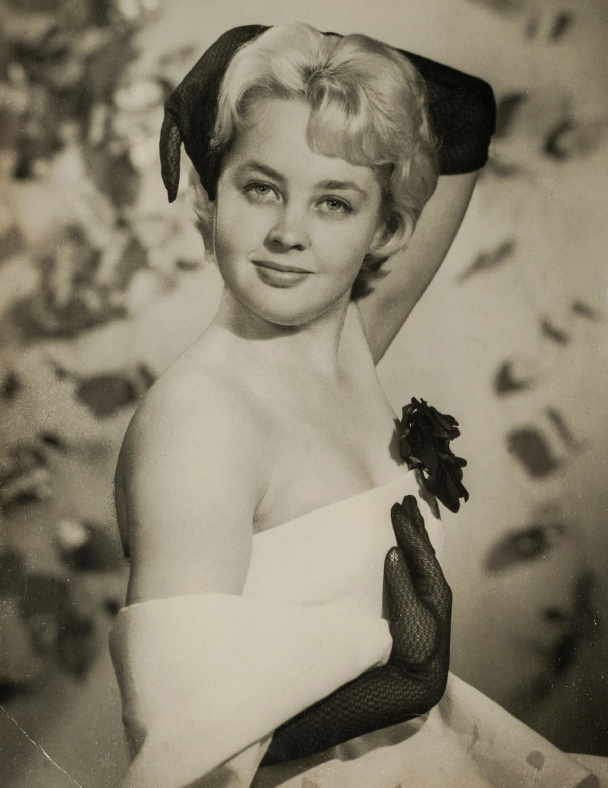 Vicki Goodwin in an archive image wearing a glamorous dress and black gloves