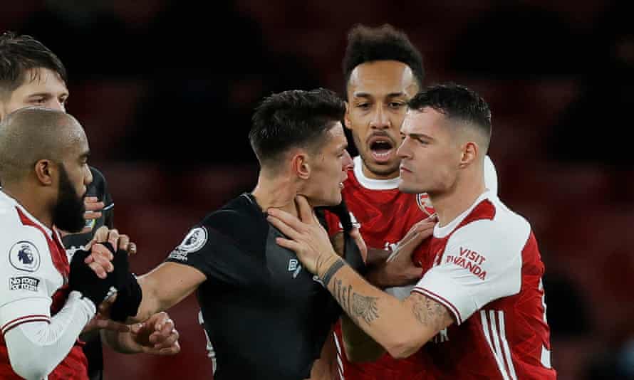 Granit Xhaka grabs Burnley’s Ashley Westwood to earn a red card.