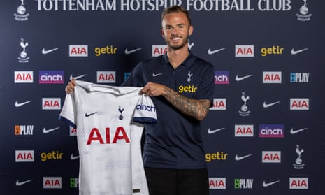James Maddison holds a Tottenham shirt