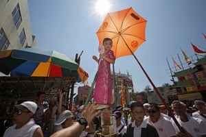 A child takes part in a parade during the Bun festival in Cheung Chau Island, Hong Kong