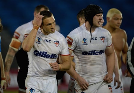 England captain Kevin Sinfield leads his beaten players off the pitch.