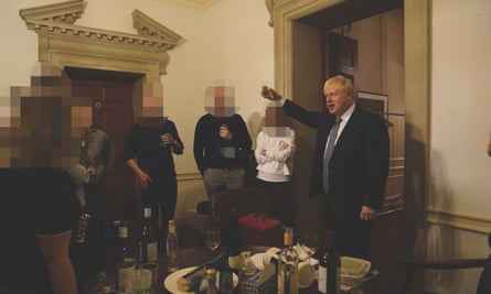 Boris Johnson (right) at a leaving gathering in the vestibule of the Press Office of 10 Downing Street
