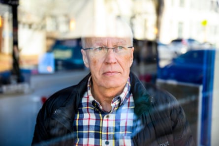 Elliot Holar looking in the window of a coffee shop, in March 2025