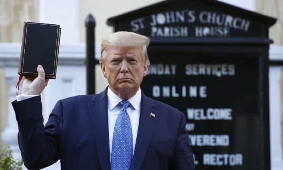 Donald Trump holds a Bible for a photo outside St John’s Church across Lafayette Park from the White House on Monday, after protestors were cleared from the area