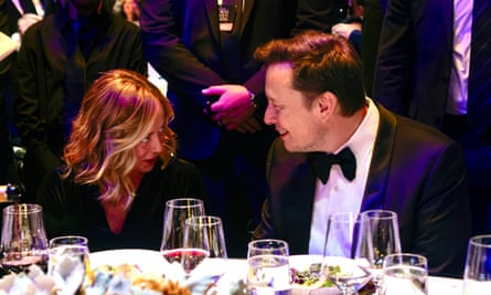 Giorgia Meloni talks with Elon Musk at a dinner table