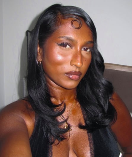 A woman of colour wearing glowing makeup