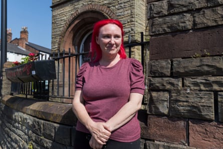 Michelle Hogan stands outside an old building