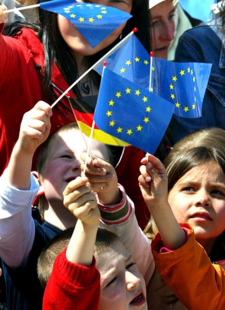 Children waving German and EU flag