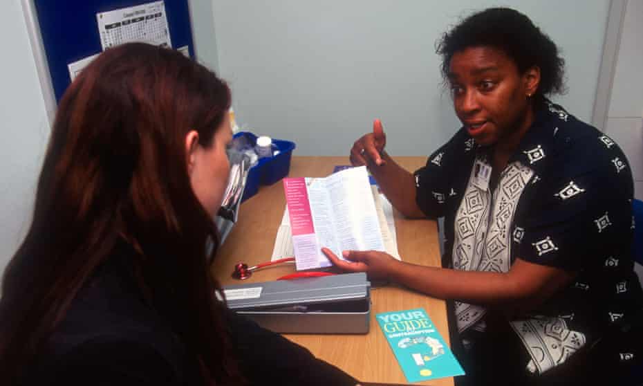 A GP giving family planning advice in Peckham, south London
