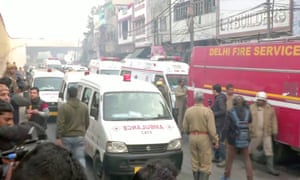 Ambulances at the scene of the deadly blaze that killed dozens of labourers in Delhi.