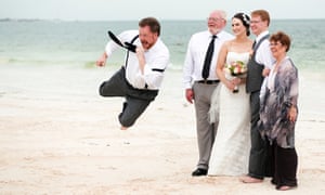 A man photobombs his family’s wedding photo