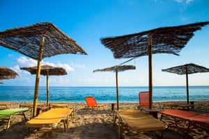 parasols at beach of paliochori milos greece.
