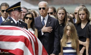 Biden and his family watch an honour guard carry his son Beau’s casket into church in Wilmington, Delaware in 2015.