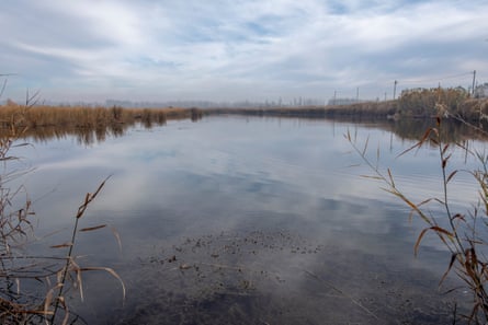 A lagoon sits beside an oil well in Calle Ciega 10 in Allen, Rio Negro province.