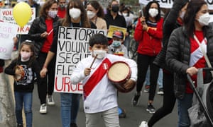 Several parents in the company of their children and supporters participate in a march to ask for the return to the classrooms, in Lima, Peru. Face-to-face classes were suspended at the start of the school year in March 2020 and the Peruvian government has not announced plans for their return due to Covid-19 fears.