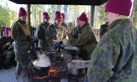 The Finnish women learn how to cook outdoors.