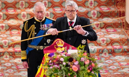 Lord Andrew Parker prepares to break his wand over Queen Elizabeth’s coffin in September.