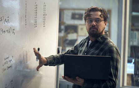 Leonardo DiCaprio presenting data written on a whiteboard