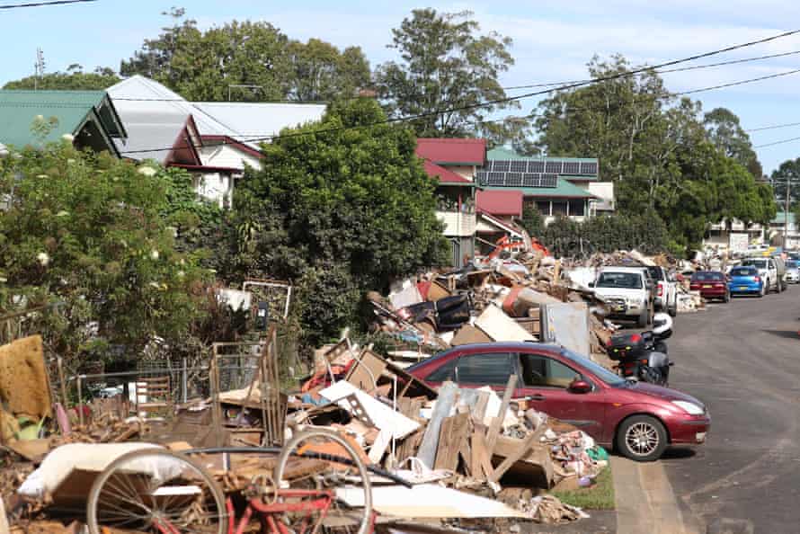Debris is strewn across the street in Lismore following the flooding.