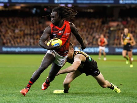 Anthony McDonald-Tipungwuti of the Bombers evades Jayden Short of the Tigers during the 2017 AFL round 10 Dreamtime at the G match between the Richmond Tigers and the Essendon Bombers at the Melbourne Cricket Ground on May 27, 2017 in Melbourne, Australia.