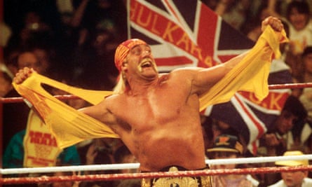 Hulk Hogan ripping shirt off in the ring with union flag being waved in crowd behind him