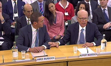 James (left) and Rupert Murdoch giving evidence to the culture, media and sport select committee in 2011.