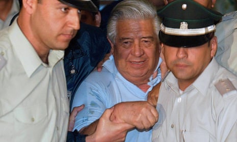 Manuel Contreras (centre) and two police officers