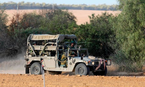 Israeli soldiers patrol close to the Israeli border with Gaza.