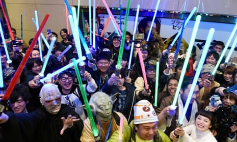 Star Wars fans pose for photographs at a cinema prior to the ‘Star Wars: The Force Awakens’ opens on December 18, 2015 in Tokyo, Japan. The film was set to break all opening weekend sales records. (Photo by The Asahi Shimbun via Getty Images)