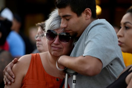 Justin Bates, who was injured in the Gilroy garlic festival mass shooting, and his mother, Lisa Barth, attend a vigil outside of city hall, in Gilroy, California, on 29 July 2019.
