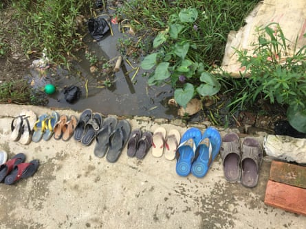 Children’s shoes lined up outside the front door of a private orphanage in Myanamar.