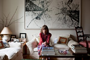 Didion in one of her signature slouchy sweaters in her elegant New York apartment in 2011.