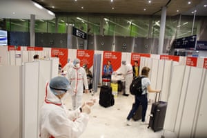 A passenger leaves after being tested for coronavirus at the Roissy Charles de Gaulle airport, outside Paris, on Saturday, 1 August, 2020.