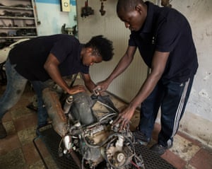 Mechanics Balde (left) and Magassa are proud of the ‘happy’ life they have in Riesi
