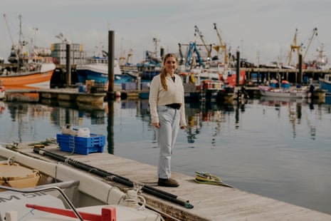 Matilda Phillips stands among the boats at Newlyn