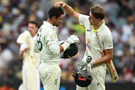 Green checks out Starc’s head after he was hit with the ball.