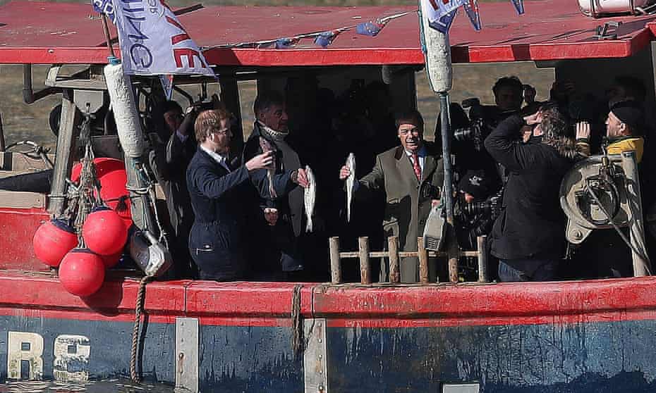 Nigel Farage throws fish into the Thames – a stunt that was filmed by the BBC