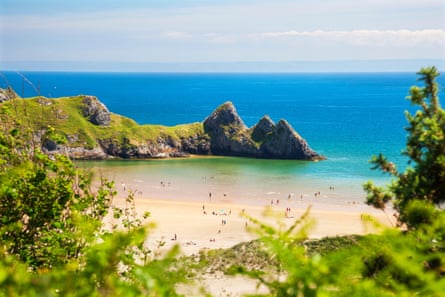 Three Cliffs Bay offers rock climbing, sand dunes and swimming.