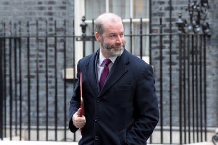 Jonathan Reynolds walks past railings in Downing Street, holding a folder